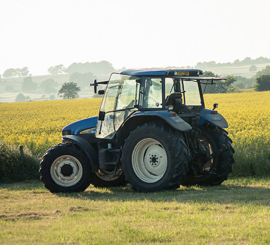 A tractor in a field- Agrisure, Farm & Agricultural Insurance